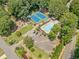 Aerial view of community amenities, including tennis courts, a pool, and a playground at 5055 Southland Dr, Woodstock, GA 30188