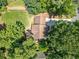 Aerial view of home with lush greenery, driveway, and manicured lawn at 5055 Southland Dr, Woodstock, GA 30188