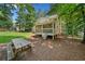 Spacious backyard featuring a picnic table, grill, and a lovely patio with a fan at 5055 Southland Dr, Woodstock, GA 30188