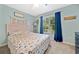 Inviting bedroom with a large window, stylish decor, and a comfortable bed at 5055 Southland Dr, Woodstock, GA 30188