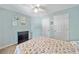 Charming bedroom with a comfortable bed, natural light, and serene decor at 5055 Southland Dr, Woodstock, GA 30188