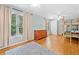 Spacious bedroom with hardwood floors, bunk beds, and large windows providing natural light at 5055 Southland Dr, Woodstock, GA 30188