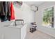 Organized walk-in closet with ample storage space, shelving, and natural light from a window at 5055 Southland Dr, Woodstock, GA 30188