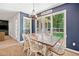 Dining room with lots of natural light and wood table at 5055 Southland Dr, Woodstock, GA 30188