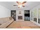 Inviting living room with a brick fireplace, built-in bookshelves, neutral tones and natural light at 5055 Southland Dr, Woodstock, GA 30188