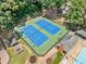 Aerial view of tennis courts, gazebo, and pool area in the community at 5055 Southland Dr, Woodstock, GA 30188