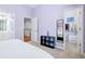 Charming bedroom featuring a cozy atmosphere, soft carpet and ensuite bathroom and walk-in closet at 5710 Waters Edge Trl, Roswell, GA 30075