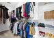 Spacious walk-in closet with ample hanging space and shelving for organized storage at 5710 Waters Edge Trl, Roswell, GA 30075