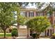 Charming brick townhouse with a one-car garage and mature trees at 5710 Waters Edge Trl, Roswell, GA 30075