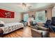 Inviting bedroom with a twin bed, ceiling fan, and a comfortable chair offering a relaxing space at 965 Grimes Bridge Rd, Roswell, GA 30075