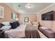 Comfortable bedroom featuring a sitting area, wood floors, bright windows, and a neutral color scheme at 965 Grimes Bridge Rd, Roswell, GA 30075