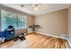 Neutral bedroom featuring hardwood floors, a window, and plenty of space for a calming retreat at 965 Grimes Bridge Rd, Roswell, GA 30075