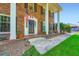 Charming brick home with a welcoming front porch, classic details, and manicured landscaping at 965 Grimes Bridge Rd, Roswell, GA 30075