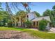 Beautiful two-story brick home with a well-maintained lawn and mature trees, showcasing curb appeal at 965 Grimes Bridge Rd, Roswell, GA 30075