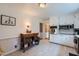 Bright kitchen featuring white cabinetry, stainless steel appliances, and neutral tile flooring at 965 Grimes Bridge Rd, Roswell, GA 30075