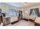 Bright kitchen with stainless steel appliances, white cabinets, and a functional layout at 965 Grimes Bridge Rd, Roswell, GA 30075