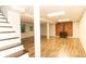 Finished basement featuring laminate floors, neutral walls, support beams, and a brick accent wall at 3873 Rains Ne Ct, Brookhaven, GA 30319