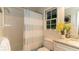 Bathroom featuring a tub with shower, neutral tile, and granite countertops at 3873 Rains Ne Ct, Brookhaven, GA 30319