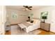 Bright bedroom with stylish furnishings, hardwood floors, and two windows at 3873 Rains Ne Ct, Brookhaven, GA 30319