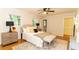 Primary bedroom with a plush bed, modern decor, and hardwood floors at 3873 Rains Ne Ct, Brookhaven, GA 30319