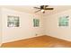 Bright bedroom showcasing hardwood floors, a ceiling fan, and natural lighting at 3873 Rains Ne Ct, Brookhaven, GA 30319