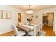 Charming dining room with a modern chandelier and seating for six at 3873 Rains Ne Ct, Brookhaven, GA 30319