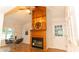 Dining room with wood-burning fireplace, vaulted ceilings, and decorative ceiling fan at 3873 Rains Ne Ct, Brookhaven, GA 30319