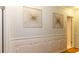 Hallway showcasing paneling, gold art, and access to other rooms in the house at 3873 Rains Ne Ct, Brookhaven, GA 30319