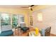 Sunroom featuring tile flooring, painted brick accent wall, and ample natural light at 3873 Rains Ne Ct, Brookhaven, GA 30319