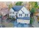 Aerial view of a two-story home with a manicured lawn, a driveway, and a two-car garage at 5105 Riverthur Pl, Duluth, GA 30096