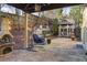 Charming backyard with a stone patio, comfortable swing chair, and gazebo perfect for entertaining at 5105 Riverthur Pl, Duluth, GA 30096