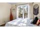 Sunlit bedroom with a cozy bed, decorative accents, and a serene view through the window at 5105 Riverthur Pl, Duluth, GA 30096