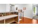 Upstairs hallway landing with built-in desk and stylish bookshelf-themed wallpaper at 5105 Riverthur Pl, Duluth, GA 30096