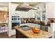 Modern kitchen with stainless steel appliances, granite countertops, and ample cabinet space at 5105 Riverthur Pl, Duluth, GA 30096
