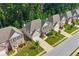 Aerial view of neighborhood homes with well-manicured lawns and mature trees at 1087 Halletts Peak Pl, Lawrenceville, GA 30044