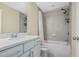 Bright bathroom featuring a bathtub with tile surround, a shower, and a vanity with white countertops at 1087 Halletts Peak Pl, Lawrenceville, GA 30044