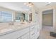 Bathroom featuring tiled floors, a walk-in shower, and double vanities at 1087 Halletts Peak Pl, Lawrenceville, GA 30044