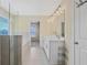 Bathroom featuring tiled floors, a glass-enclosed shower, and a double vanity at 1087 Halletts Peak Pl, Lawrenceville, GA 30044