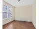Cozy bedroom featuring hardwood floors, natural light, and neutral paint at 1087 Halletts Peak Pl, Lawrenceville, GA 30044