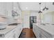 Well-lit kitchen with quartz countertops, stainless steel appliances, and modern backsplash at 1087 Halletts Peak Pl, Lawrenceville, GA 30044