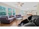 Spacious living room featuring a comfortable couch, hardwood floors, and lots of natural light at 1087 Halletts Peak Pl, Lawrenceville, GA 30044