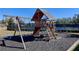 Community playground with swings, slide, and climbing structure near tennis courts at 1087 Halletts Peak Pl, Lawrenceville, GA 30044