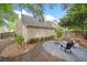 Landscaped backyard featuring fire pit area, greenery, and wooden fence to give a sense of privacy at 172 Stoneforest Dr, Woodstock, GA 30189