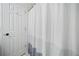 Clean bathroom featuring a white shower curtain with gray stripes at 172 Stoneforest Dr, Woodstock, GA 30189