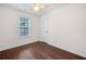 Bedroom with hardwood floors and a window at 172 Stoneforest Dr, Woodstock, GA 30189