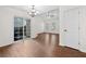 Open living space with sliding glass doors and laminate floors at 172 Stoneforest Dr, Woodstock, GA 30189
