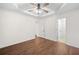 Spacious main bedroom with hardwood floors and tray ceiling at 172 Stoneforest Dr, Woodstock, GA 30189