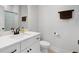 Bathroom featuring a white vanity with black hardware, toilet, and shower at 852 Constellation Dr, Decatur, GA 30033