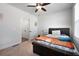 Bedroom with neutral walls, carpet, a ceiling fan, and an open door to a closet at 852 Constellation Dr, Decatur, GA 30033