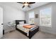 Bright bedroom featuring natural light, a ceiling fan, and carpeted floors at 852 Constellation Dr, Decatur, GA 30033